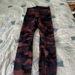 Wunder train size 4 Lululemon leggings worn once! Great condition with a tank!